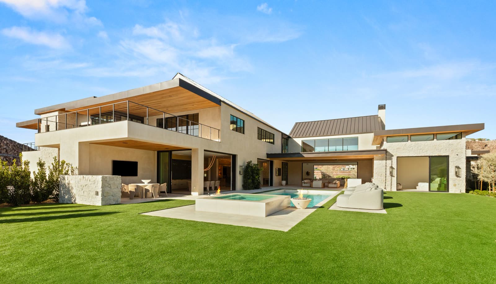 Pool terrace and lawn at the rear of a custom residence