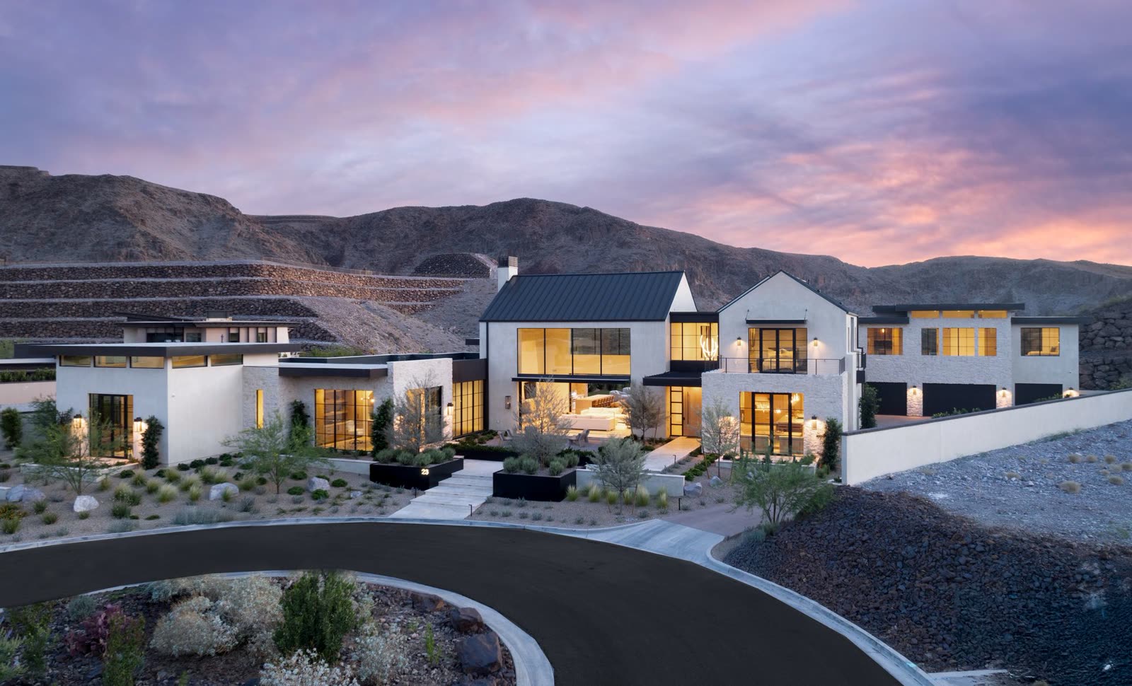 A hillside custom residence at dusk above the Las Vegas valley