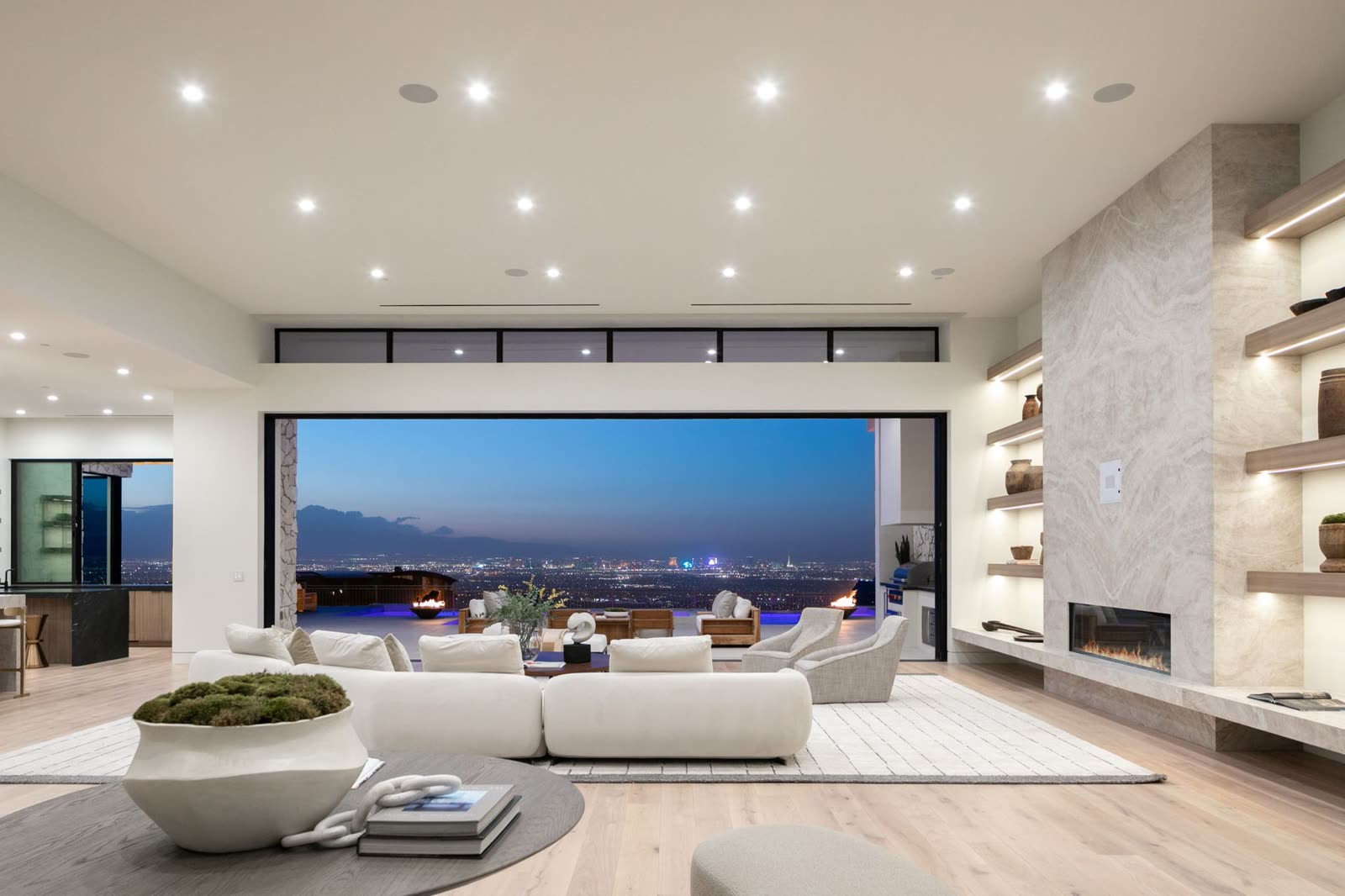Living room framing the Las Vegas skyline through a wall of glass
